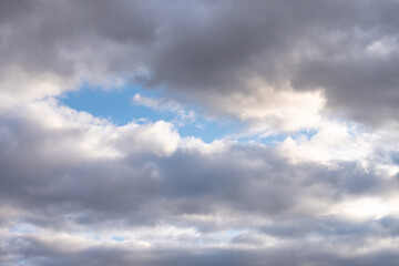 blue sky with dark clouds