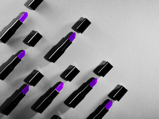 Creative pattern fashion photo of cosmetics beauty products lipsticks