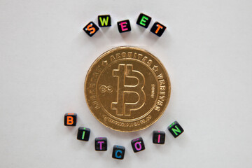 sweet chocolate bitcoin on white background