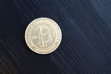 sweet chocolate bitcoin on black background