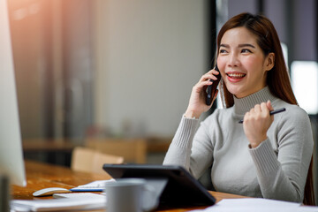 Asian young woman using calculator and laptop, checking domestic bills, sitting at table with financial documents, managing planning budget, accounting expenses, browsing internet service