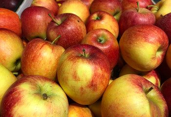 Box of yellow and red apples