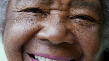 A happy senior African woman macro closeup face smiling - Powered by Adobe