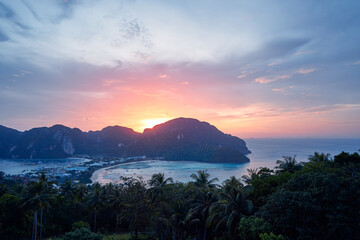 Wonderful sunset on Phi Phi Don island view point. Beautiful landscape with tropical sea lagoon.