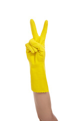 housekeeping concept - hand in yellow rubber glove showing two fingers - victory sign isolated on...