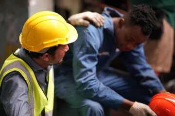 Portrait of Professional Heavy Industry Engineer / Worker Wearing Safety Uniform, Goggles and Hard Hat. In the Background Unfocused Large Industrial Factory