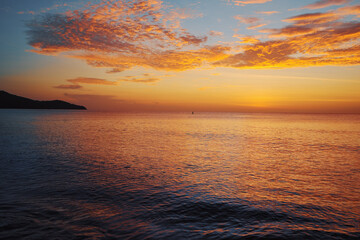 Beautiful seascape with sunset cloudy sky.