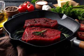 Concept of tasty food with raw beef steaks, close up