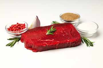 Concept of tasty food with raw beef steak on white background