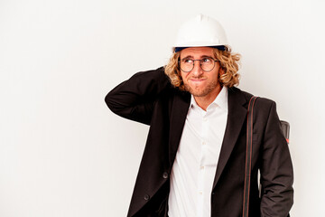 Young architect caucasian man with helmet isolated on white background touching back of head, thinking and making a choice.