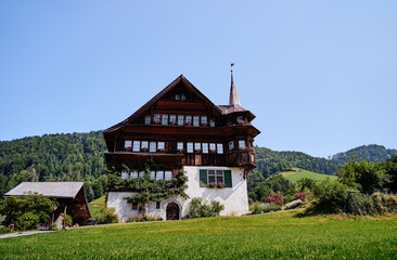 Fototapeta na wymiar Travel by Switzerland. Swiis architecture. Ancient wooden house.