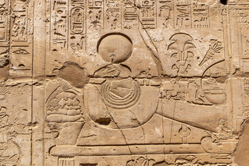 Relief details and Egyptian hieroglyphs at Karnak temple complex in Luxor