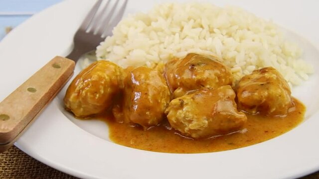 curry chicken dumpling with rice on a plate