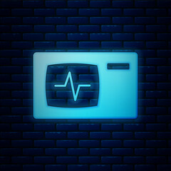 Glowing neon Computer monitor with cardiogram icon isolated on brick wall background. Monitoring icon. ECG monitor with heart beat hand drawn. Vector