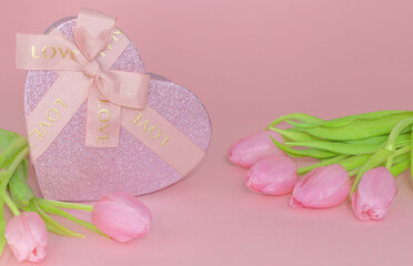 Bouquet of tulips with heart-shaped gift box