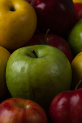Colorful apples. Red, yellow and green apples on a wooden tray
