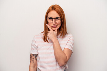 Young caucasian woman isolated on white background contemplating, planning a strategy, thinking about the way of a business.