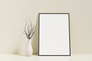 Minimalist and clean vertical black poster or photo frame mockup on the floor leaning against the room wall with vase