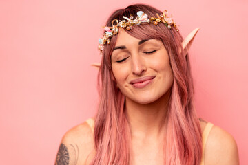 Young caucasian elf woman isolated on pink background