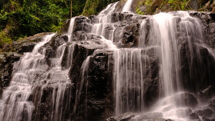 Fototapeta premium Long exposure Sa Lad Dai Waterfall located in Ban Na District, Nakhon Nayok, Thailand.