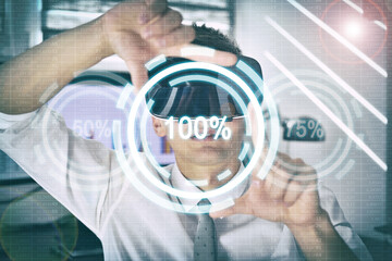 Businessman with VR glasses using digital financial percentage interface.