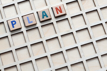 Plan the word arranged with wooden letters.