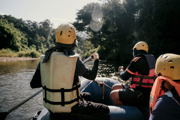 female tourist sitting on a rubber raft Rafting in the Wa River Rivers of Nan Province, Thailand