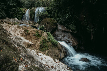 A beautiful large waterfall in the middle of a deep forest, a tropical rainforest in northern Thailand.