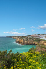 Fototapeta na wymiar Townscape of Carvoeiro in the Algarve and rocky coastline