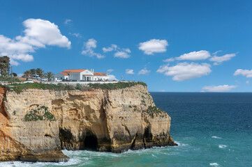 Fototapeta na wymiar Rocky coast with chapel near Carvoeiro in the Algarve