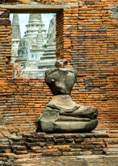 Aytthaya, Thailand, 22 Aug 2020 : Ancient old buddha statue sculpture is damaged at the old temple in Ayuthaya province, thailand. Selective focus.