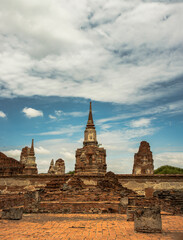 Fototapeta premium Aytthaya, Thailand, 22 Aug 2020 : World Heritage Site at Wat phra mahathat. Ancient city and historical place at Ayutthaya, Thailand, The Ruin of temple. No focus, specifically.