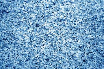 Fototapeta na wymiar Granite surface as background with blur effect in navy blue tone.