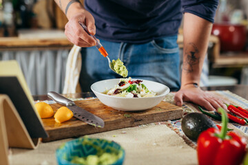 man preparing food in his kitchen