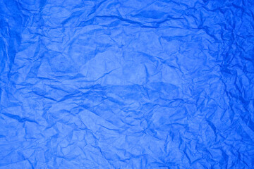 Textured blue paper background.