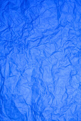 Textured blue paper background.