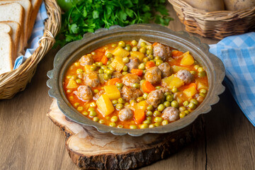 Turkish Food Green Pea Stew with Meatballs - Kofte or Kofta Bezelye. (Turkish name; kofteli bezelye)