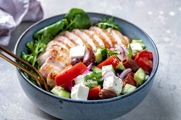 Grilled chicken breast. Fried chicken fillet and fresh vegetable salad with tomatoes, cucumber and...