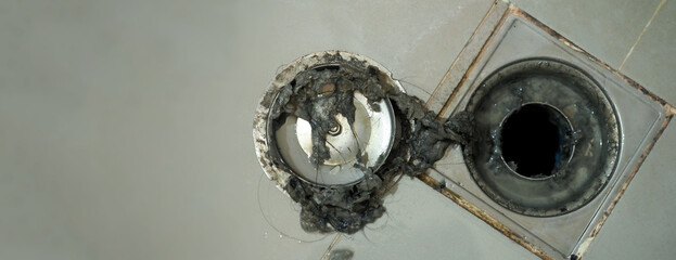 Drain cleaning. Clogged and dirty sewer pipes floor drain. Full of hair and accumulated clogged...