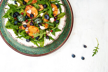 Arugula salad with grilled apricots, berries and goat cheese, banner, catering menu recipe place for text, top view