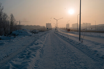 Newly built large avenue. New residential area. Construction site. Buildings under construction. Harsh winter. Ust-Kamenogorsk (kazakhstan)