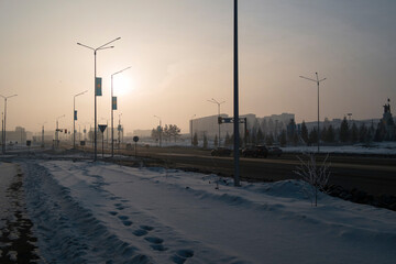 Newly built large avenue. Monument of Independence. Traffic. Harsh winter. New residential area. Ust-Kamenogorsk (kazakhstan)