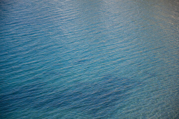 Calm sea water top view. Ocean wallpaper.