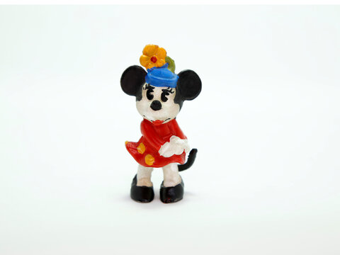 Minnie Mouse retro toy figure. Plastic doll. Vintage. Isolated. Cartoon character from Walt Disney Pictures Studios. Mickey is Minnie Mouse's boyfriend. Mickey Mouse's house. Classic Minnie.