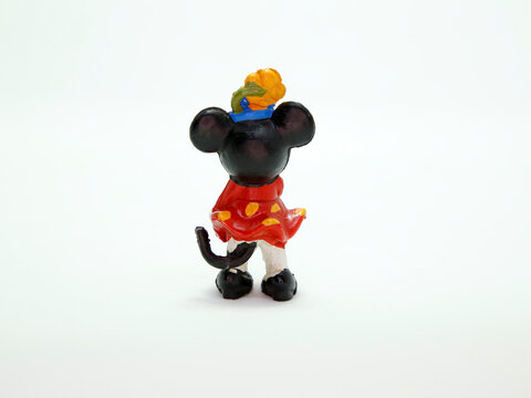 Minnie Mouse retro toy figure. Plastic doll. Vintage. Isolated. Cartoon character from Walt Disney Pictures Studios. Mickey is Minnie Mouse's boyfriend. Mickey Mouse's house. Classic Minnie. Back view
