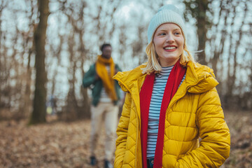 View of men and women walking on a rocky path in the woods. A couple of hikers exploring nature...