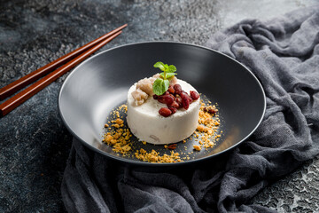 Ice cream with beans and peanuts on dark stone table, Chinese cuisine