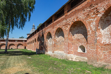 Zaraysk, Russia - July 6, 2021: The stone wall of the Zaraisk Kremlin fortress in the historical center of Zaraisk in the summer