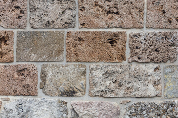 The texture of the stone wall. Background texture of the stone wall of the old castle.