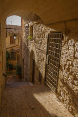 Picturesque cityscape in the pink stone city of Assisi in Perugia, Italy
